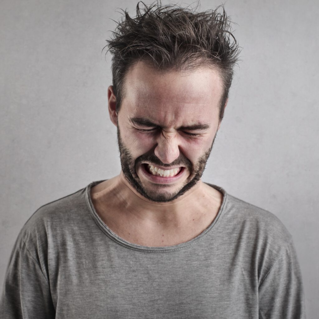 Plaatje pijn man gezicht